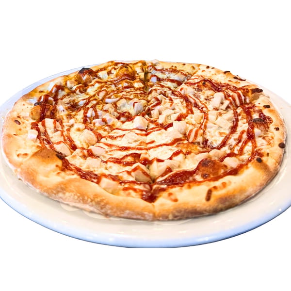 A BBQ chicken pizza from Amore Pasta & Pizza, drizzled with sauce and cut into slices.